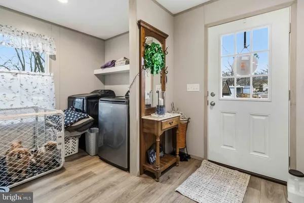 a kitchen with stainless steel appliances granite countertop a stove a refrigerator and a microwave