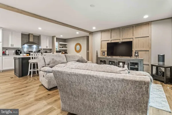 a large bedroom with a bed and furniture