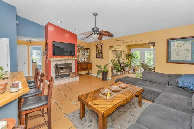 a living room with fireplace furniture and a flat screen tv