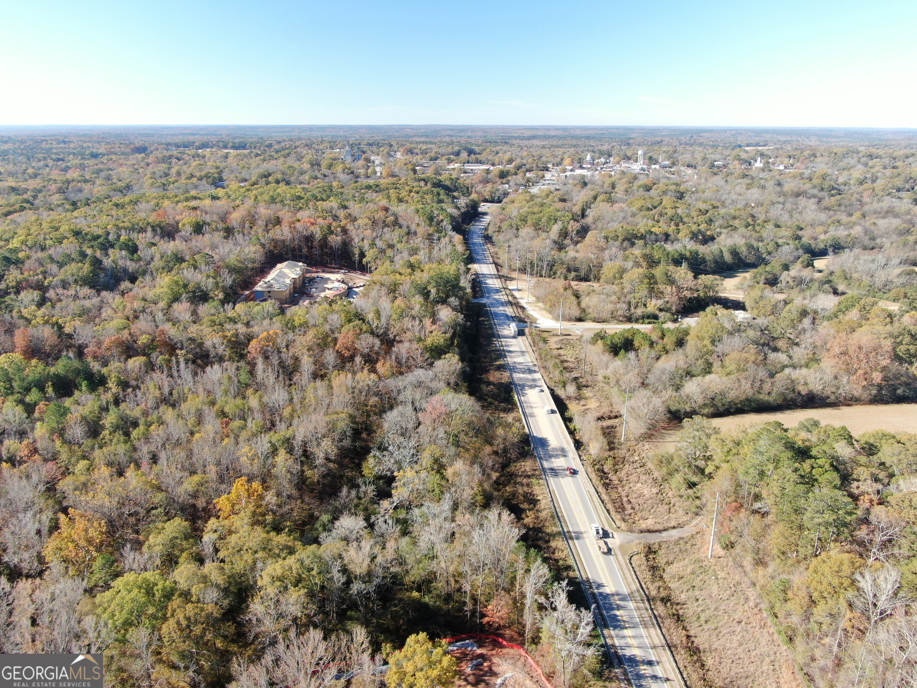 103 Greensboro Road Eatonton, GA 31024 - Photo 14 of 23 an aerial view of house with yard and mountain view in back