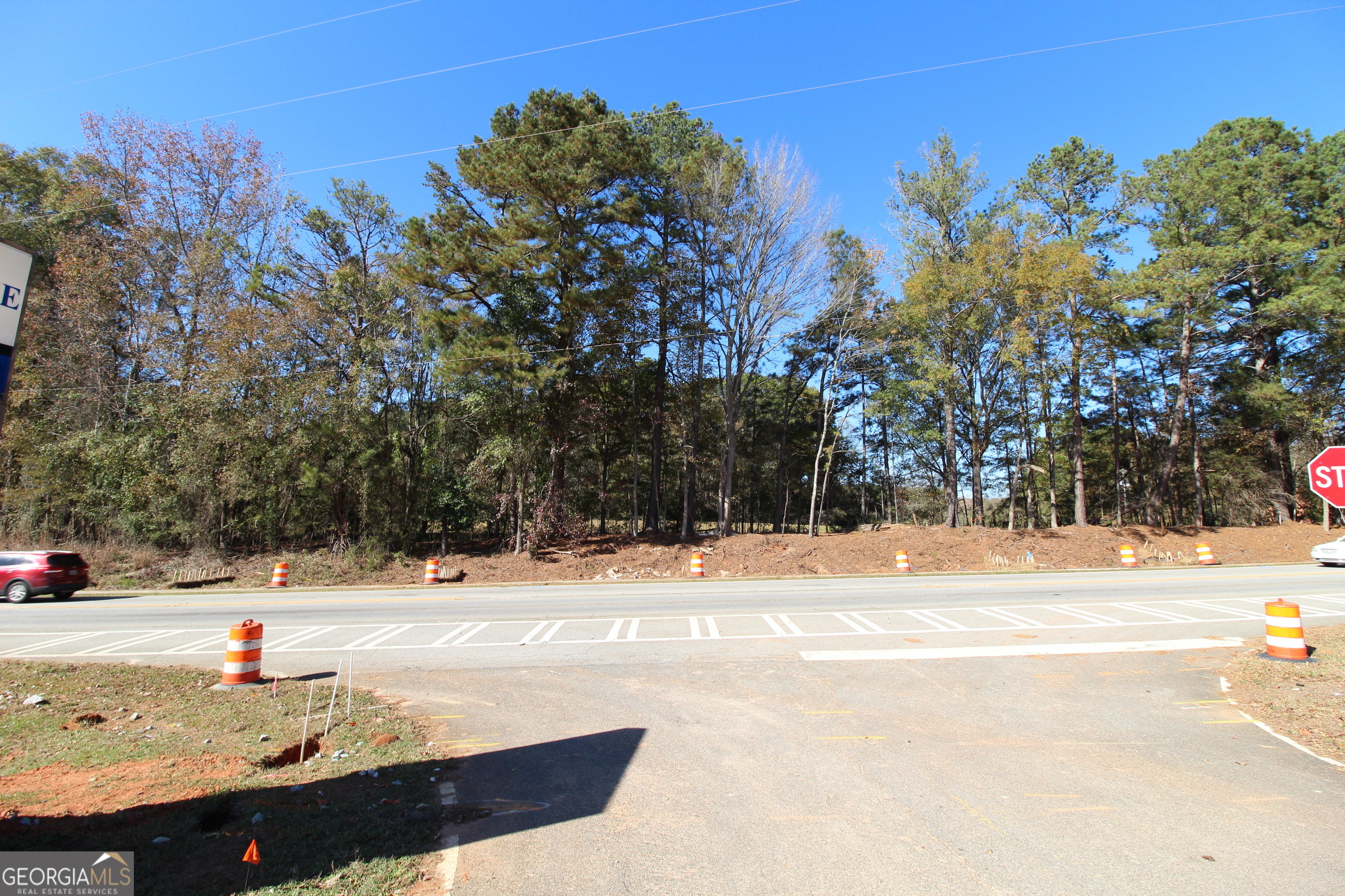 103 Greensboro Road Eatonton, GA 31024 - Photo 5 of 23 a view of road with large trees