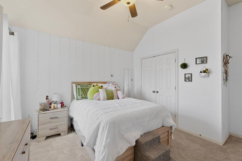 4004 White Porch Road Plano, TX 75024 - Photo 27 of 40 a bedroom with a bed and a dresser