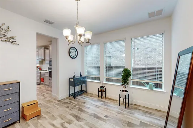 a view of living room filled with furniture and a large window