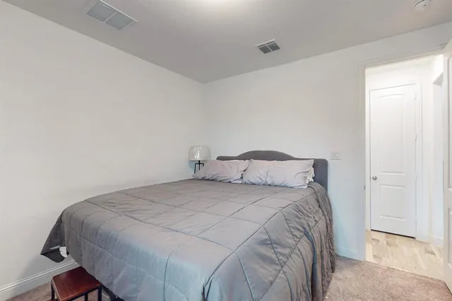 a bedroom with a bed and a cabinets
