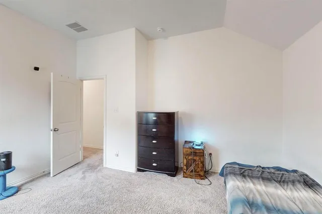 a living room with a furniture and a ceiling fan