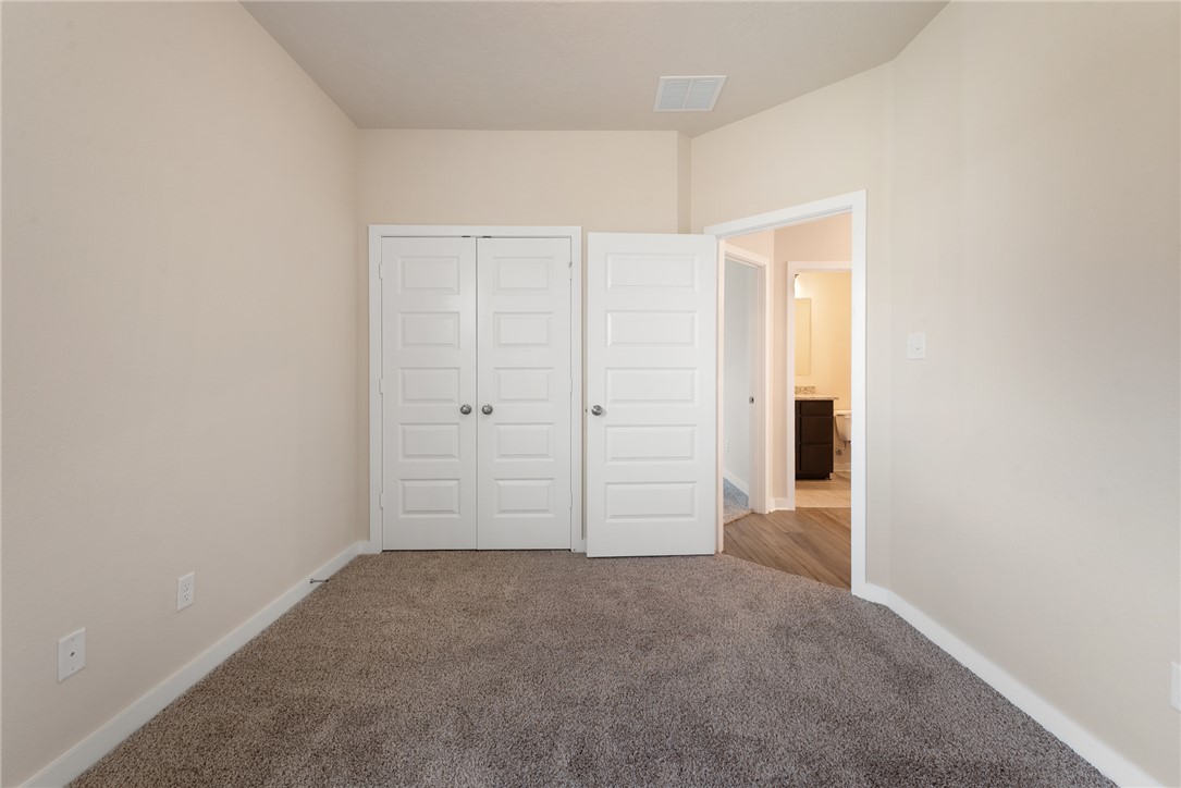 2427 Rooke Road Bryan, TX 77807 - Photo 27 of 38 an empty room with closet area