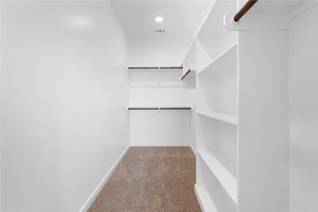 a view of an empty walk in closet