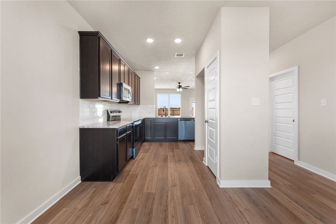 2427 Rooke Road Bryan, TX 77807 - Photo 10 of 38 a view of a kitchen from the hallway