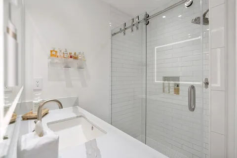 a bathroom with a sink and a shower