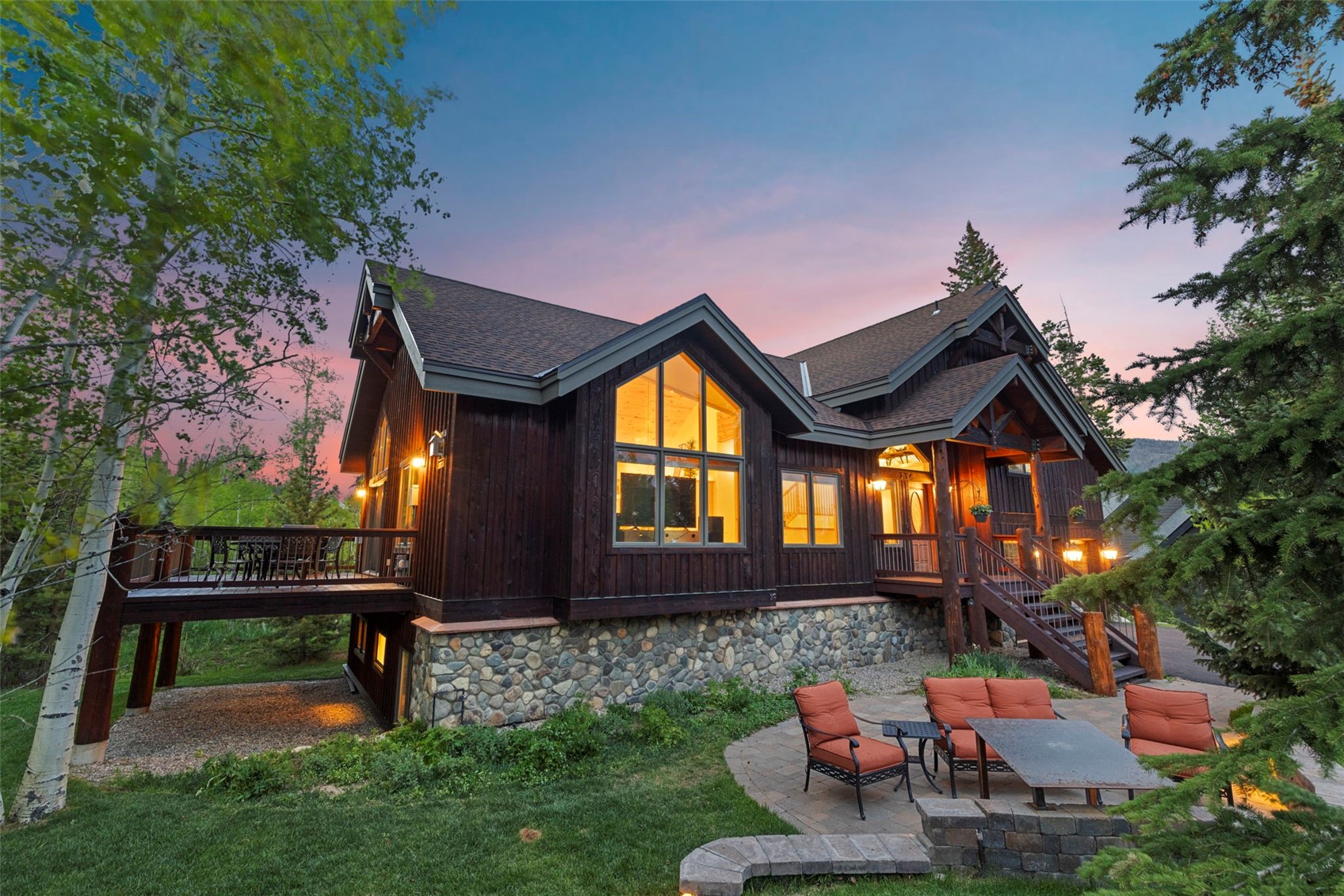 736 Wild Rose Road Silverthorne, CO 80498 - Photo 5 of 49 Back of property featuring a patio area, stairs, a deck, a shingled roof, and an outdoor living space