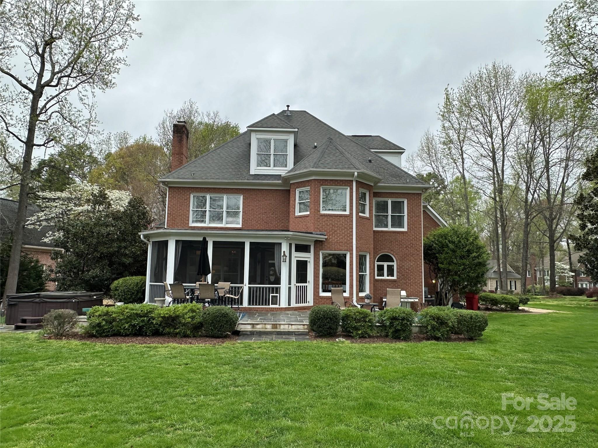 19622 River Falls Drive Davidson, NC 28036 - Photo 16 of 25 a front view of a house with a garden