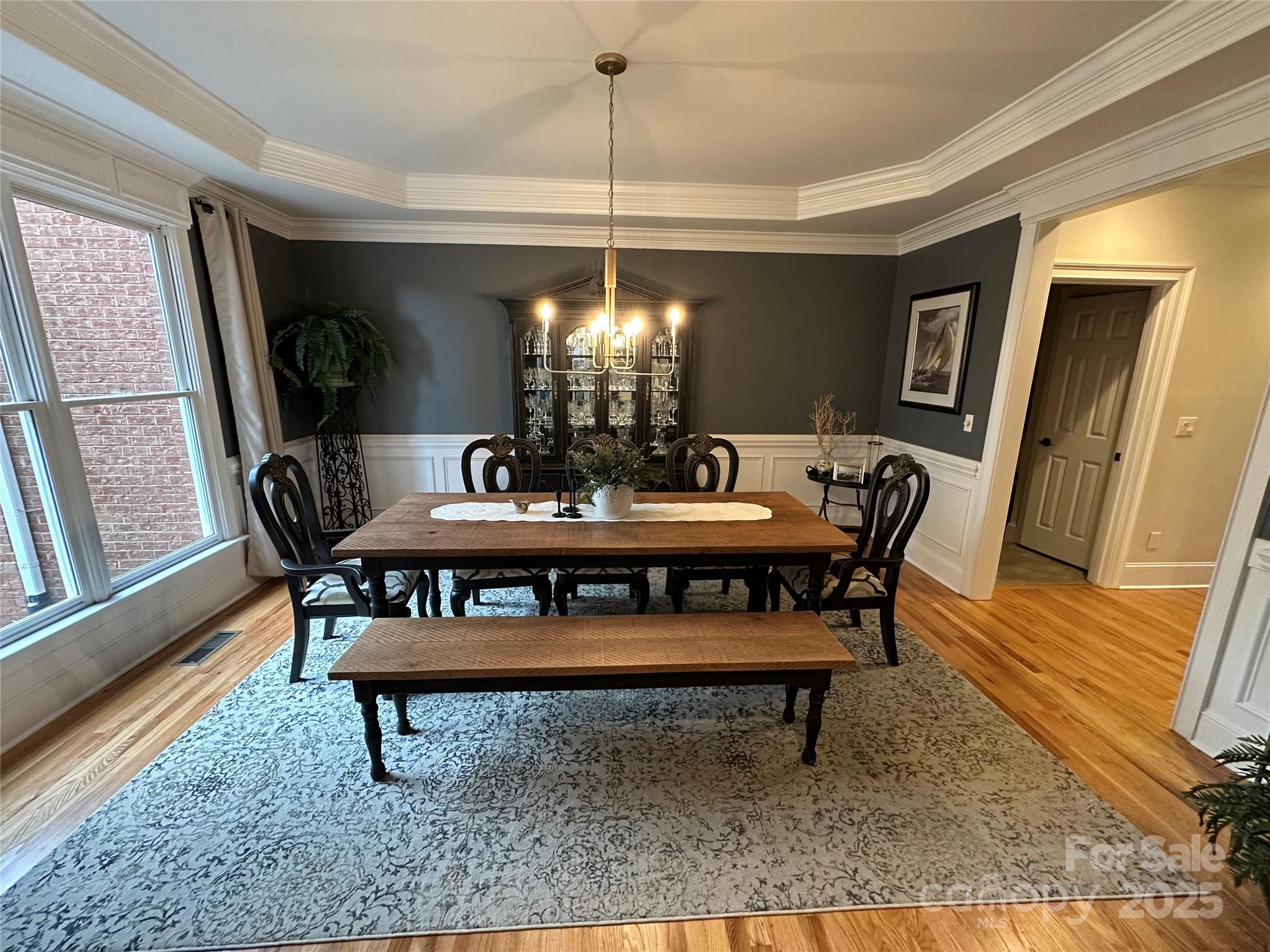 19622 River Falls Drive Davidson, NC 28036 - Photo 2 of 25 a view of a dining room with furniture window and wooden floor