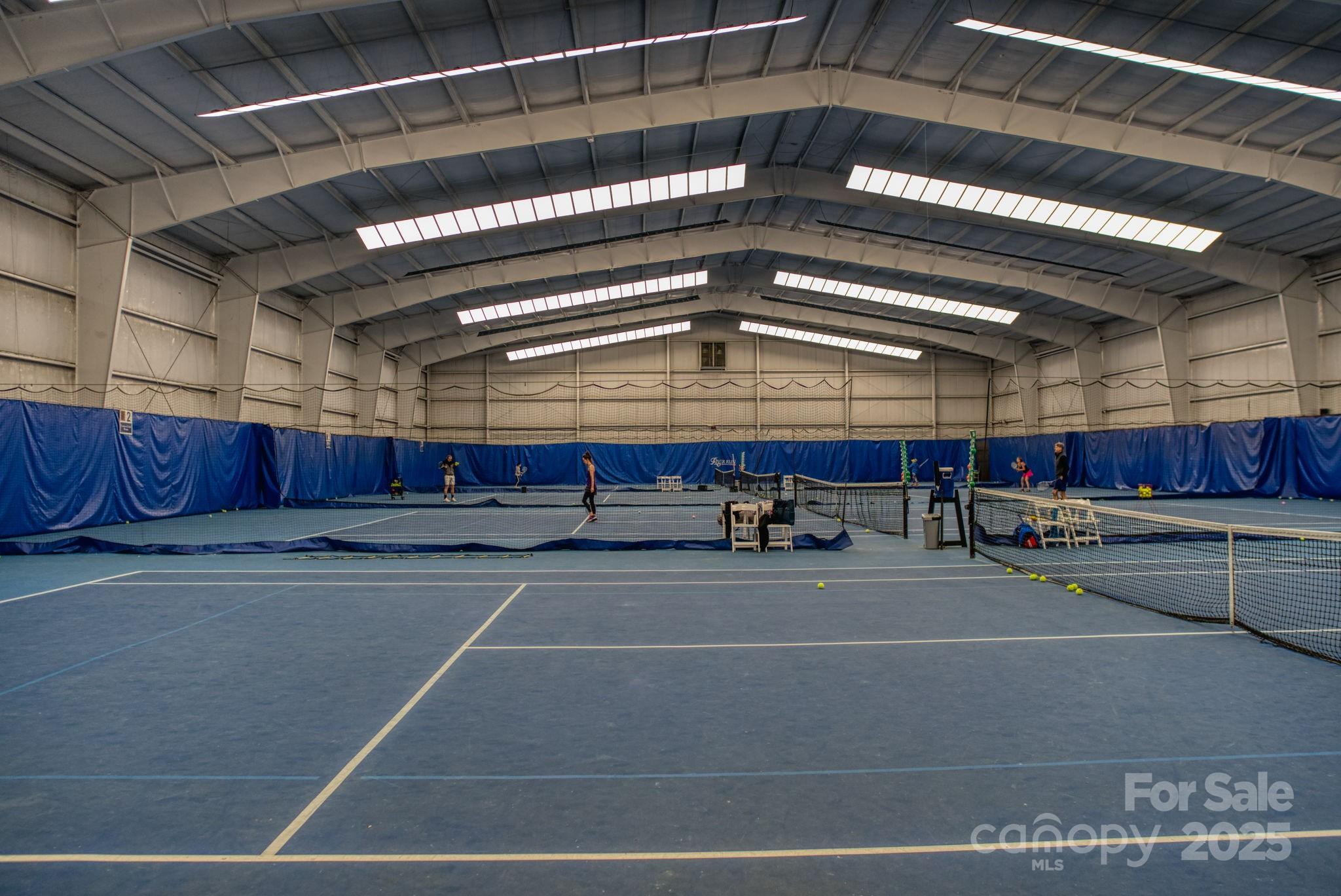 19622 River Falls Drive Davidson, NC 28036 - Photo 24 of 25 a room with wooden cabinets and a fireplace