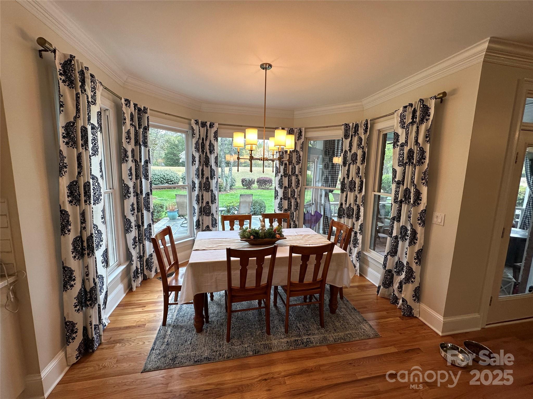 19622 River Falls Drive Davidson, NC 28036 - Photo 9 of 25 a view of a dining room with furniture window and outside view