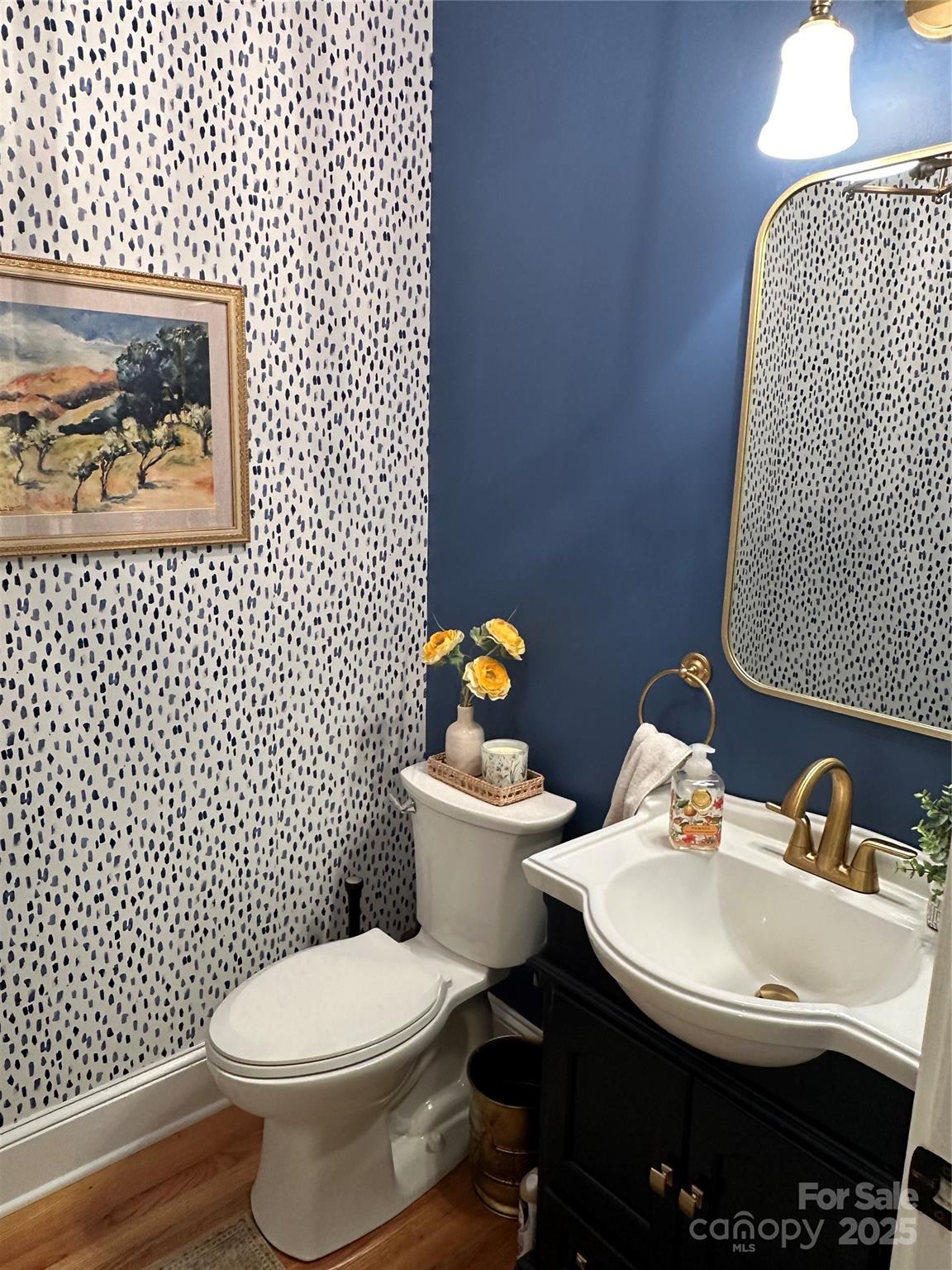 19622 River Falls Drive Davidson, NC 28036 - Photo 10 of 25 a white toilet sitting next to a bathroom sink