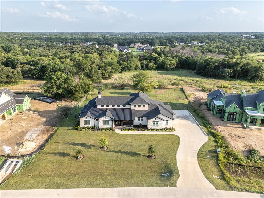 an aerial view of a house with yard swimming pool and outdoor seating