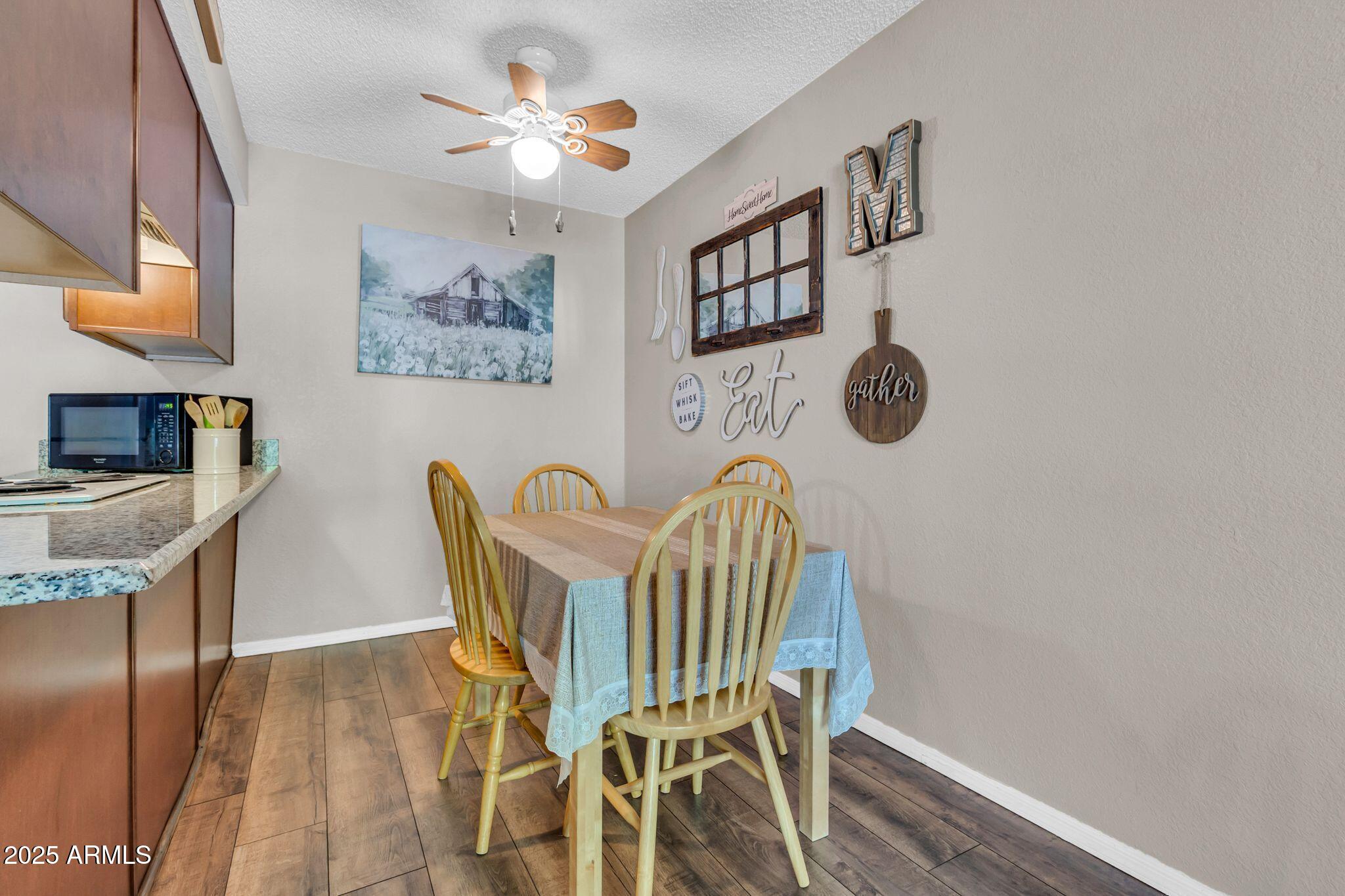 1440 North Idaho Road, Unit 2060 Apache Junction, AZ 85119 - Photo 14 of 24 a view of a dining room with furniture