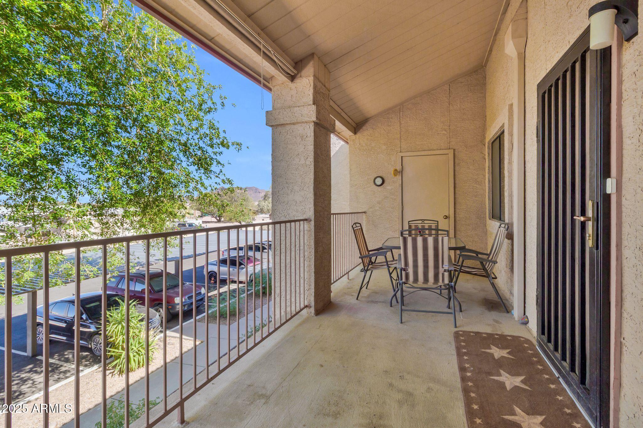 1440 North Idaho Road, Unit 2060 Apache Junction, AZ 85119 - Photo 19 of 24 a view of balcony with furniture