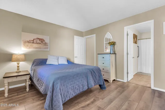 a bedroom with a bed and a walk in closet