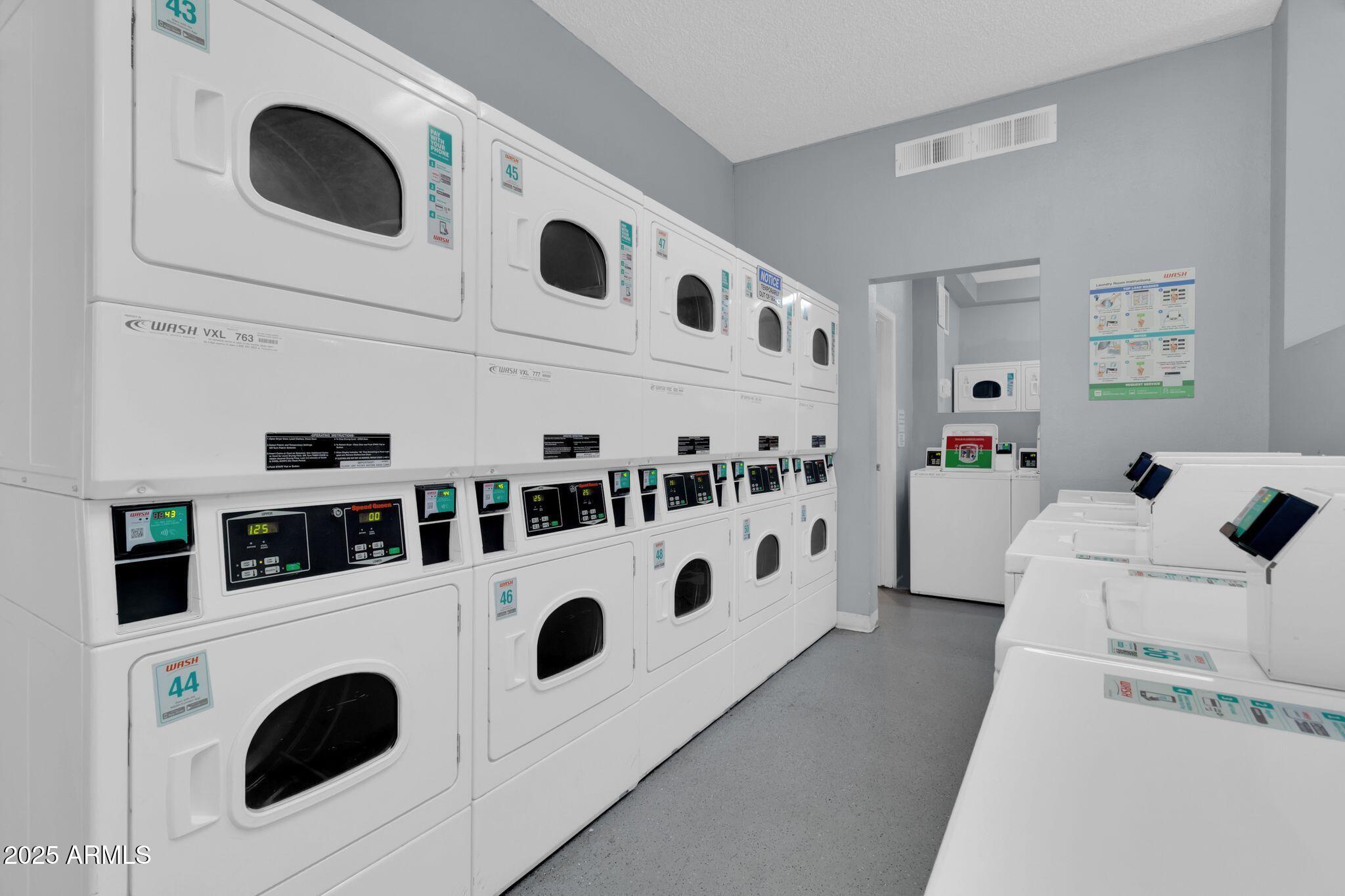 1440 North Idaho Road, Unit 2060 Apache Junction, AZ 85119 - Photo 21 of 24 a view of kitchen with washer and dryer