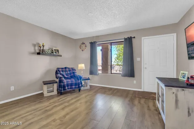 a living room with furniture and a window