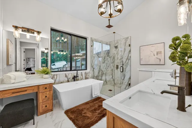 a roof deck with table and chairs wooden floor and fence