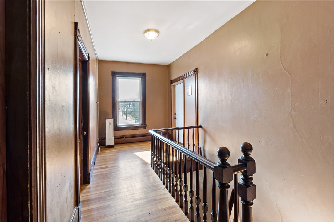 222 Carrington Avenue Woonsocket, RI 02895 - Photo 17 of 46 Main Hallway, leads to 1st Floor unit 2 (left) and Unit 3 on second floor, as well as office and 4th unit