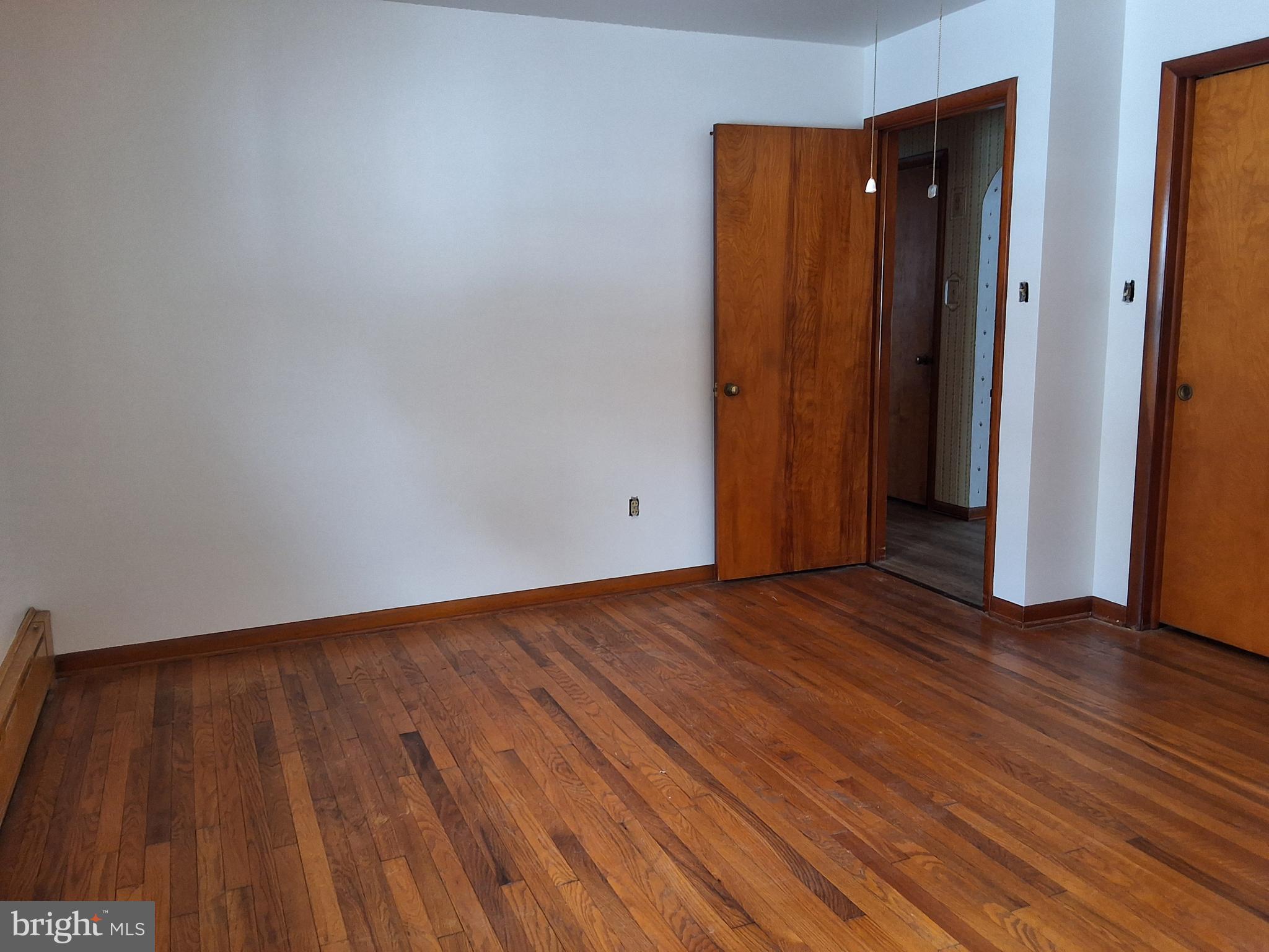 130 Fairland Road Lititz, PA 17543 - Photo 11 of 22 a view of an empty room with wooden floor and closet