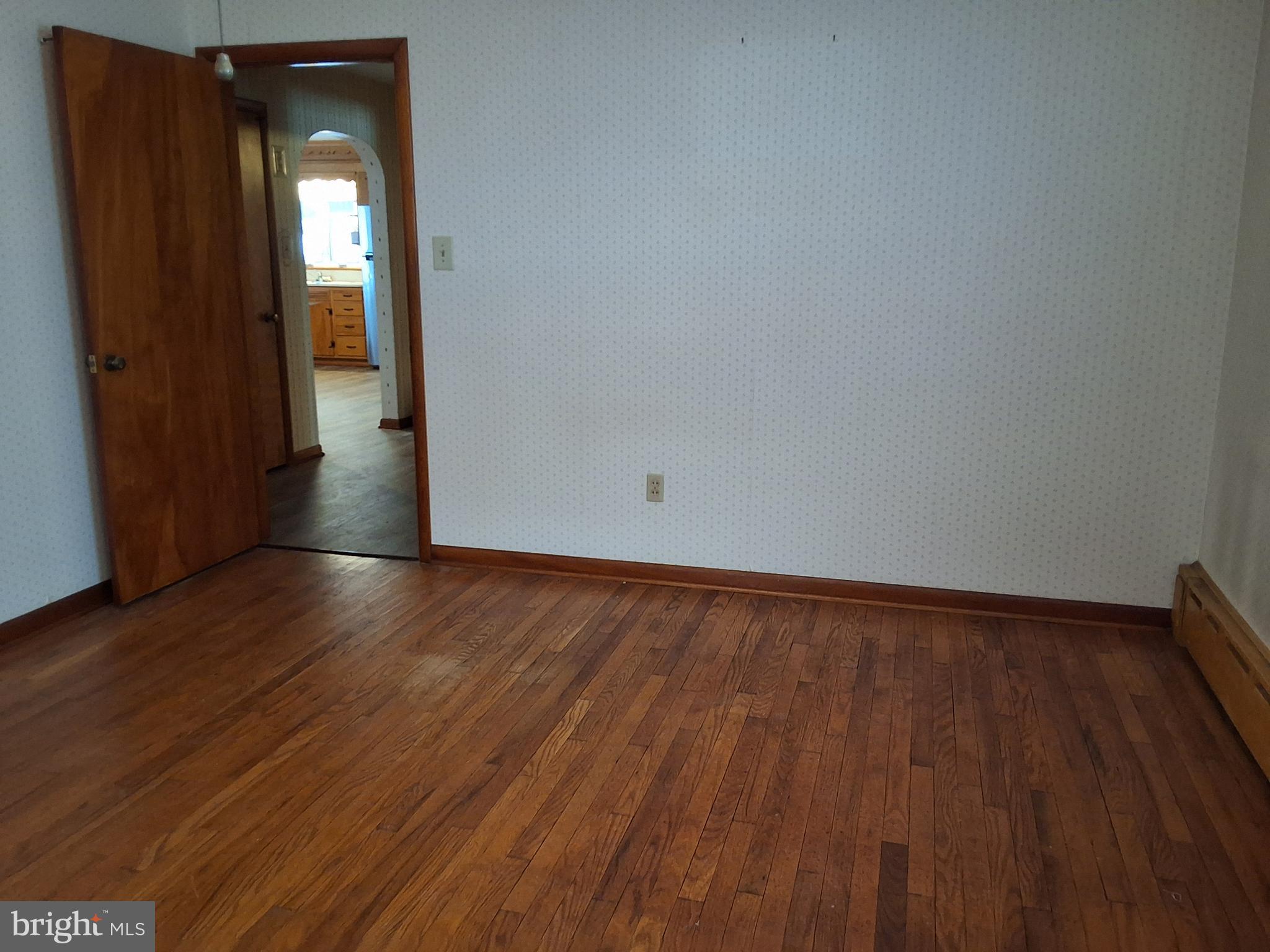 130 Fairland Road Lititz, PA 17543 - Photo 14 of 22 a view of an empty room with wooden floor and a window