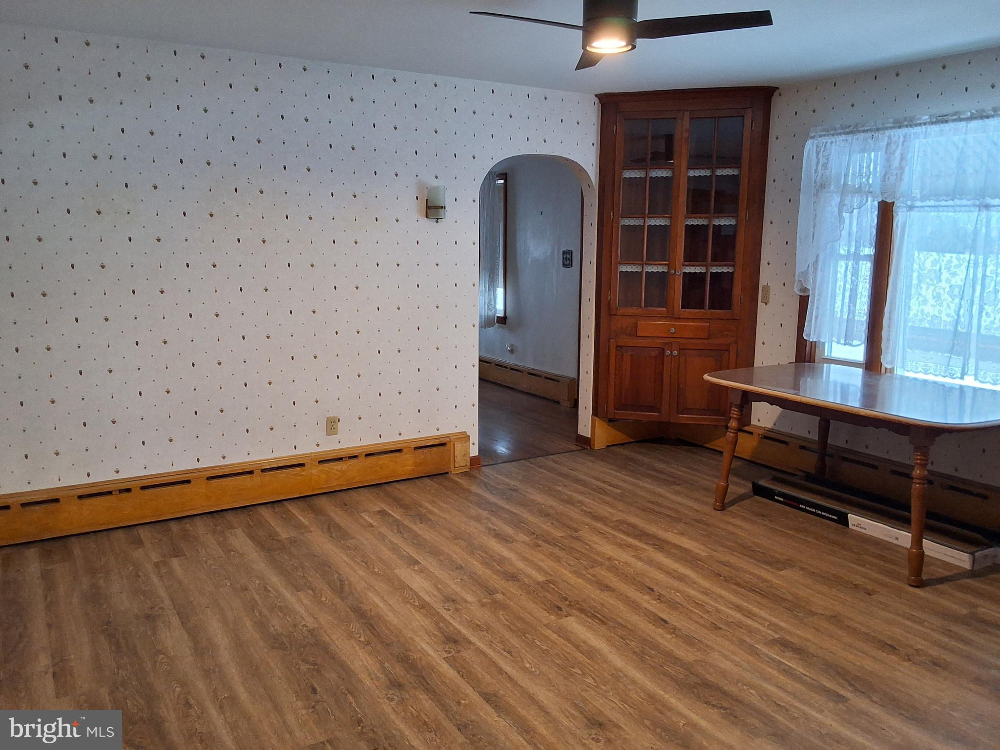 130 Fairland Road Lititz, PA 17543 - Photo 6 of 22 an empty room with wooden floor and windows
