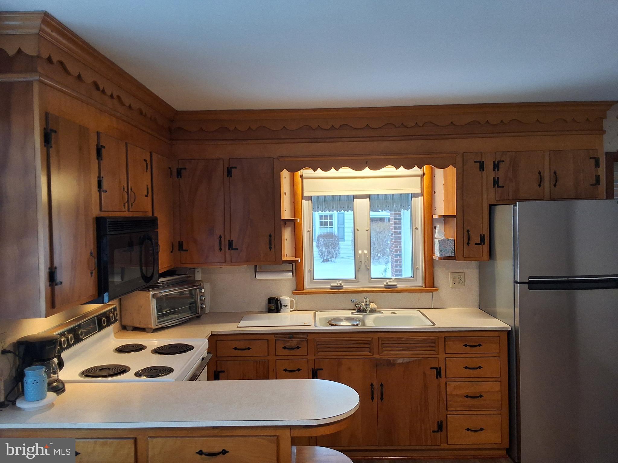 130 Fairland Road Lititz, PA 17543 - Photo 8 of 22 a kitchen with a sink stove and refrigerator