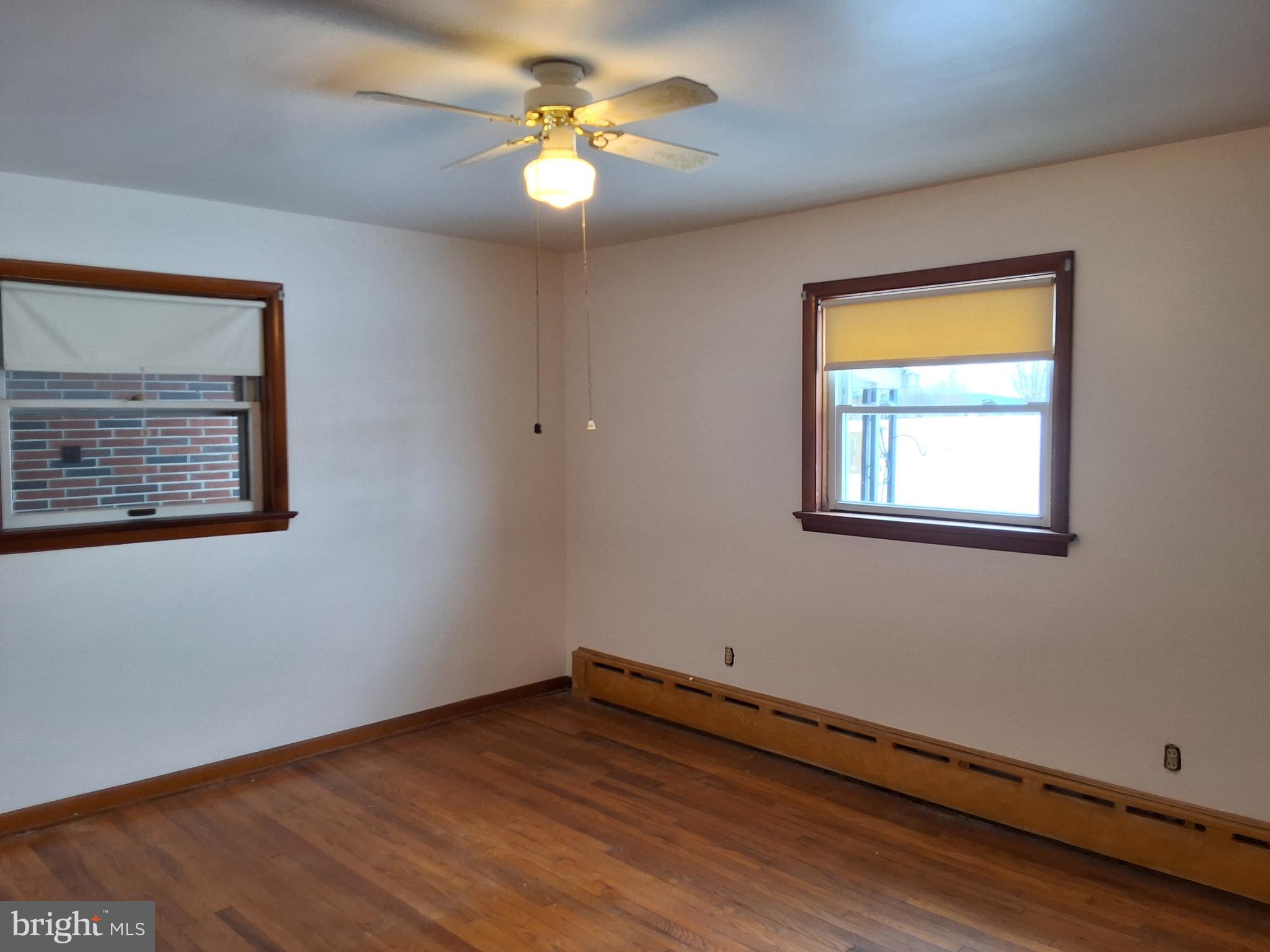 130 Fairland Road Lititz, PA 17543 - Photo 10 of 22 a view of an empty room with window and wooden floor