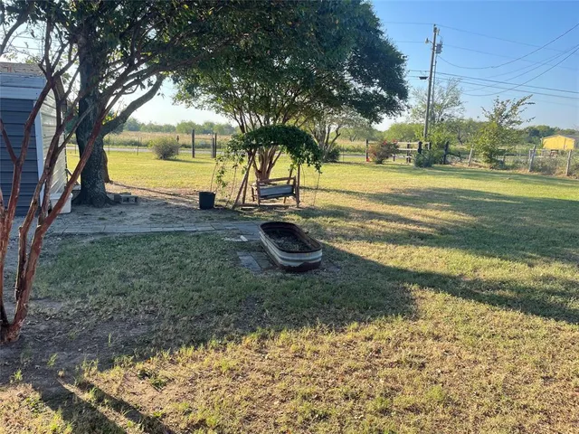 a view of a yard with an trees