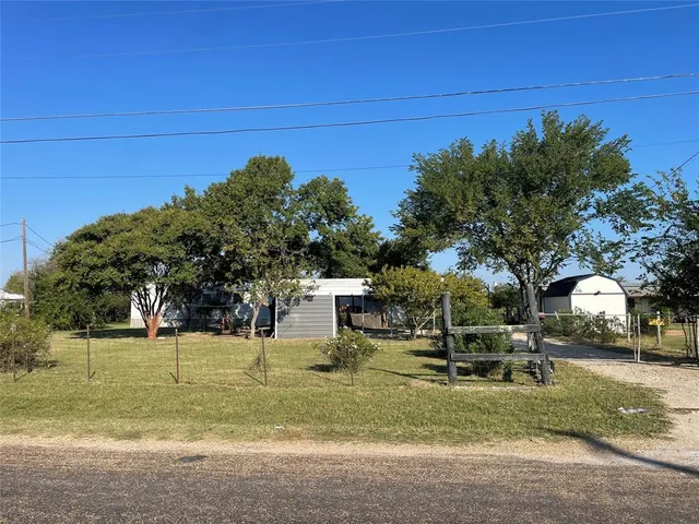 a view of yard with swimming pool