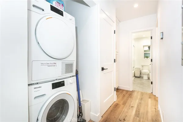 a view of a hallway with washer and dryer