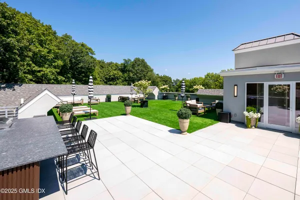 a view of house with patio outdoor seating