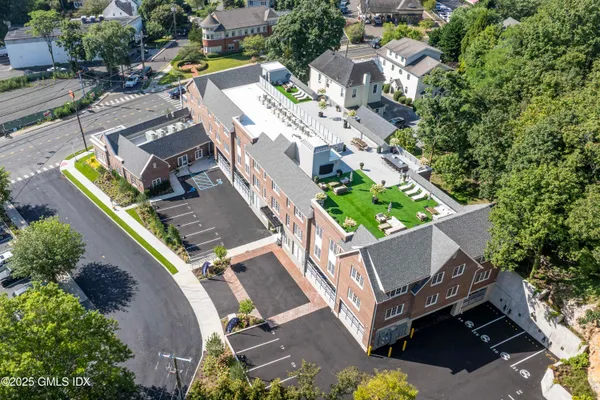 an aerial view of residential house with outdoor space and swimming pool