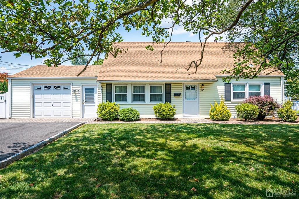6 Frederick Avenue Colonia, NJ 07067 - Photo 1 of 33 front view of a house with a garden