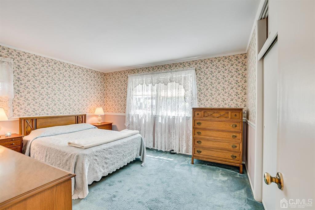 6 Frederick Avenue Colonia, NJ 07067 - Photo 21 of 33 a bedroom with two beds and painted walls