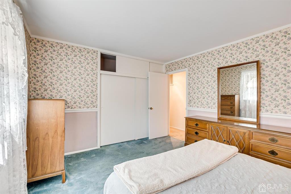 6 Frederick Avenue Colonia, NJ 07067 - Photo 22 of 33 a bedroom with a bed and a window