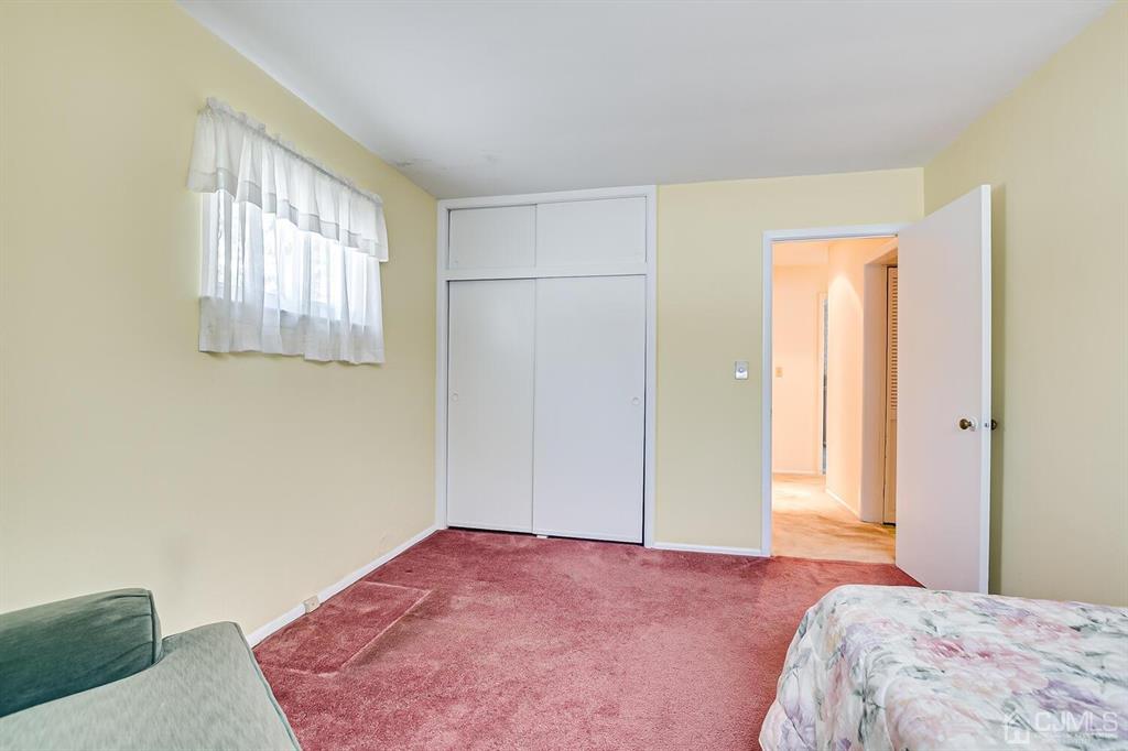 6 Frederick Avenue Colonia, NJ 07067 - Photo 25 of 33 a bedroom with a bed and a window