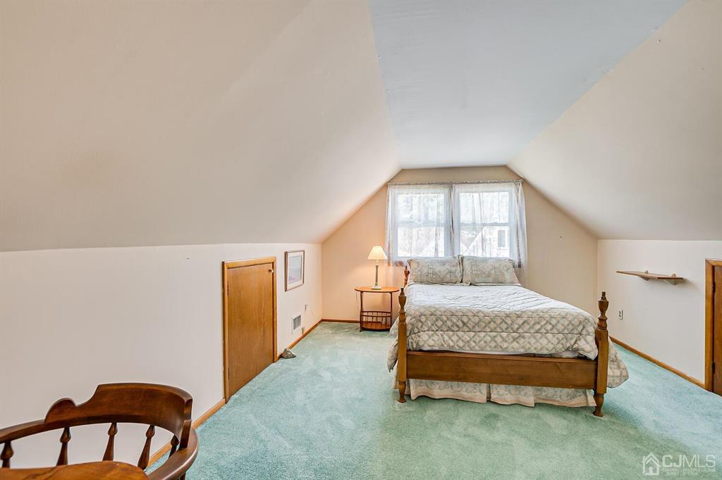 6 Frederick Avenue Colonia, NJ 07067 - Photo 28 of 33 a spacious bedroom with a bed and a window