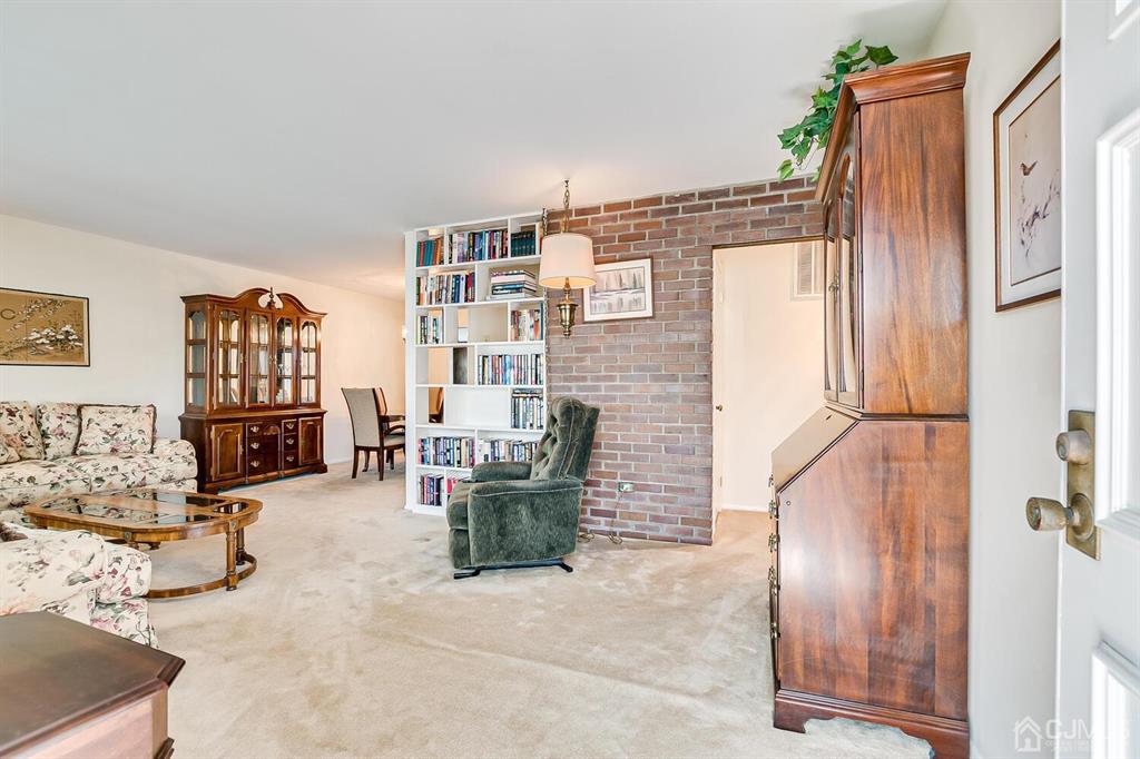 6 Frederick Avenue Colonia, NJ 07067 - Photo 6 of 33 a living room with furniture a rug and white walls