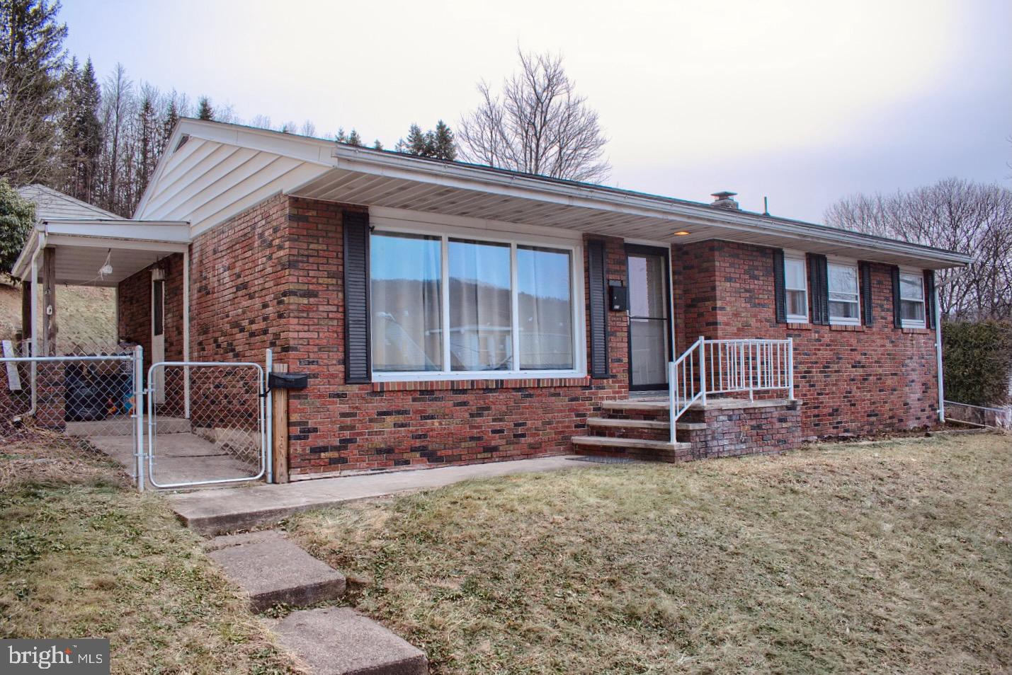 924 Hemlock Street Shamokin, PA 17872 - Photo 1 of 6 a front view of a house with garden