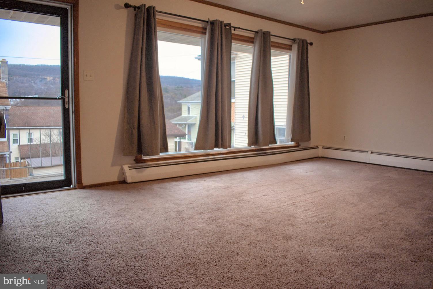 924 Hemlock Street Shamokin, PA 17872 - Photo 3 of 6 an empty room with windows
