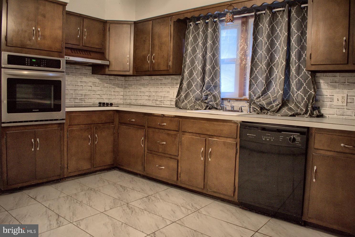 924 Hemlock Street Shamokin, PA 17872 - Photo 4 of 6 a kitchen with a sink and cabinets