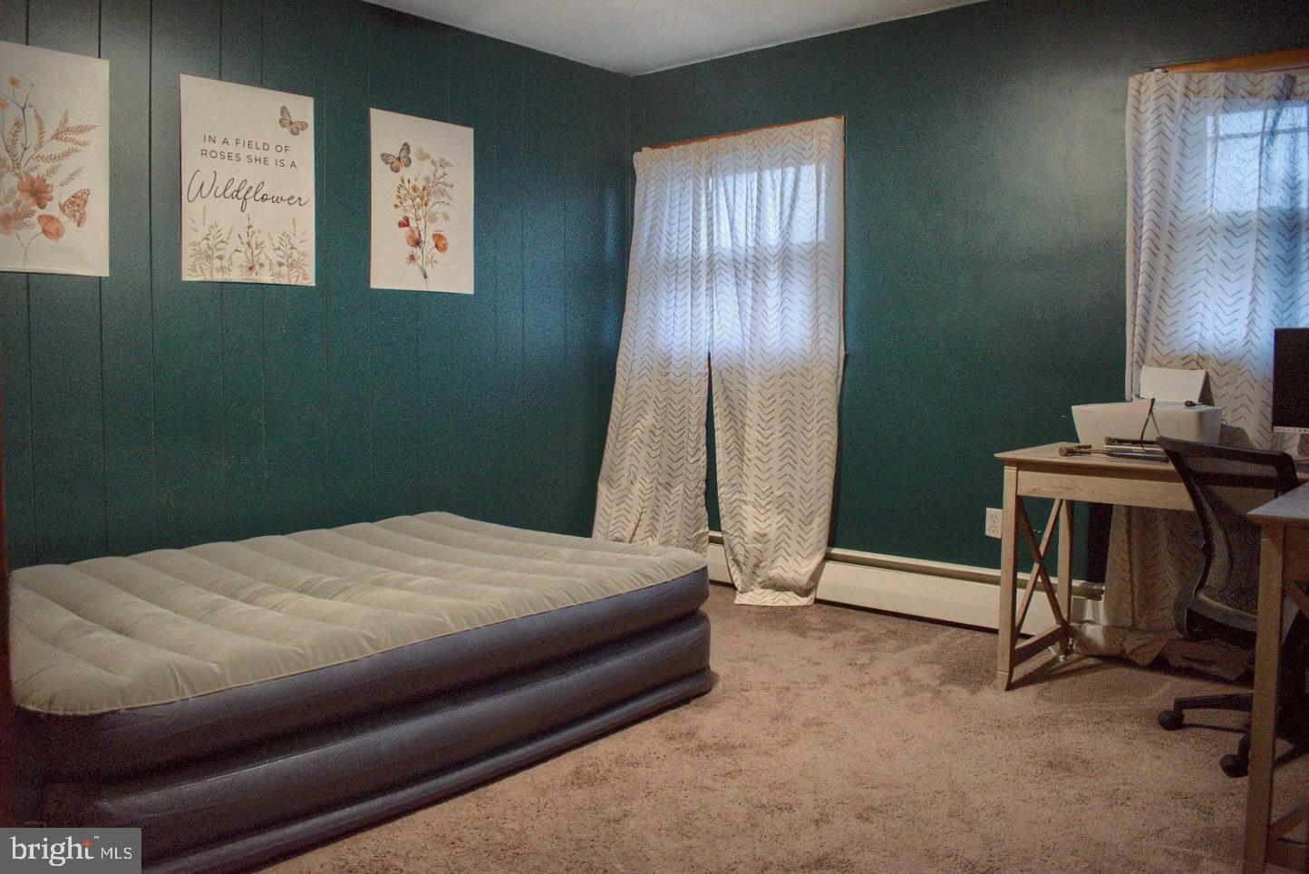 924 Hemlock Street Shamokin, PA 17872 - Photo 5 of 6 a bedroom with a bed and a window
