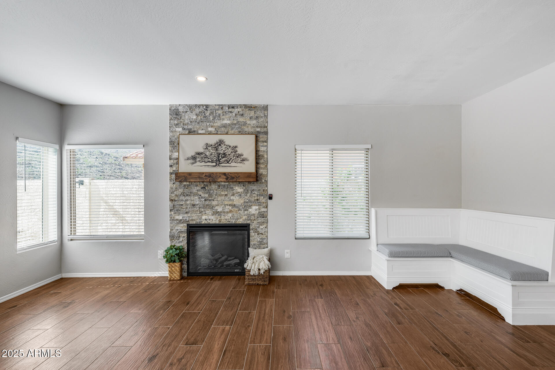14452 South 40th Street Phoenix, AZ 85044 - Photo 30 of 92 an empty room with wooden floor fireplace and windows