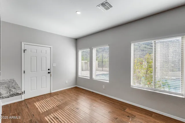 a bathroom with a double vanity sink and mirror
