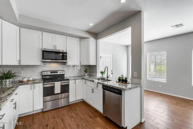 a living room with couch and a window